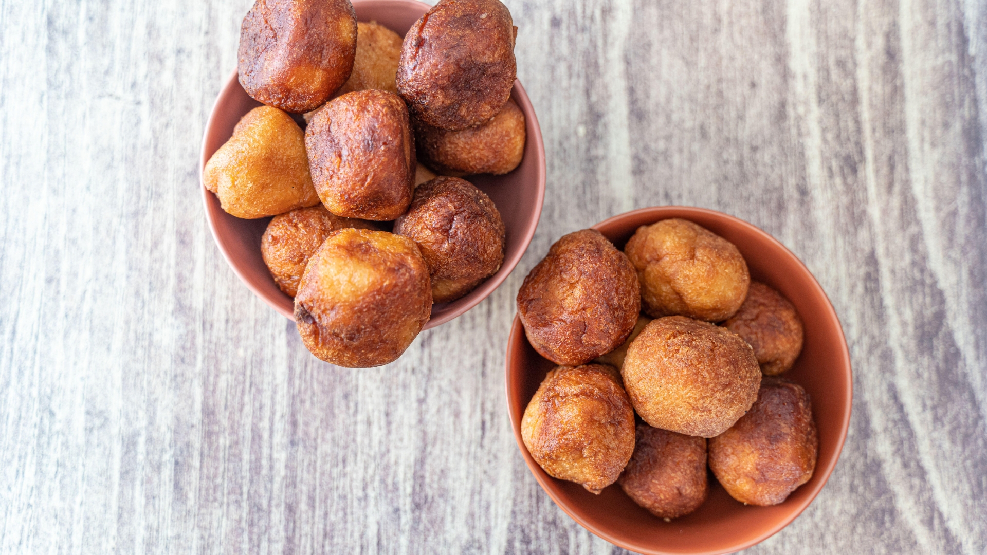 Twin bowls of Nigerian puff puff