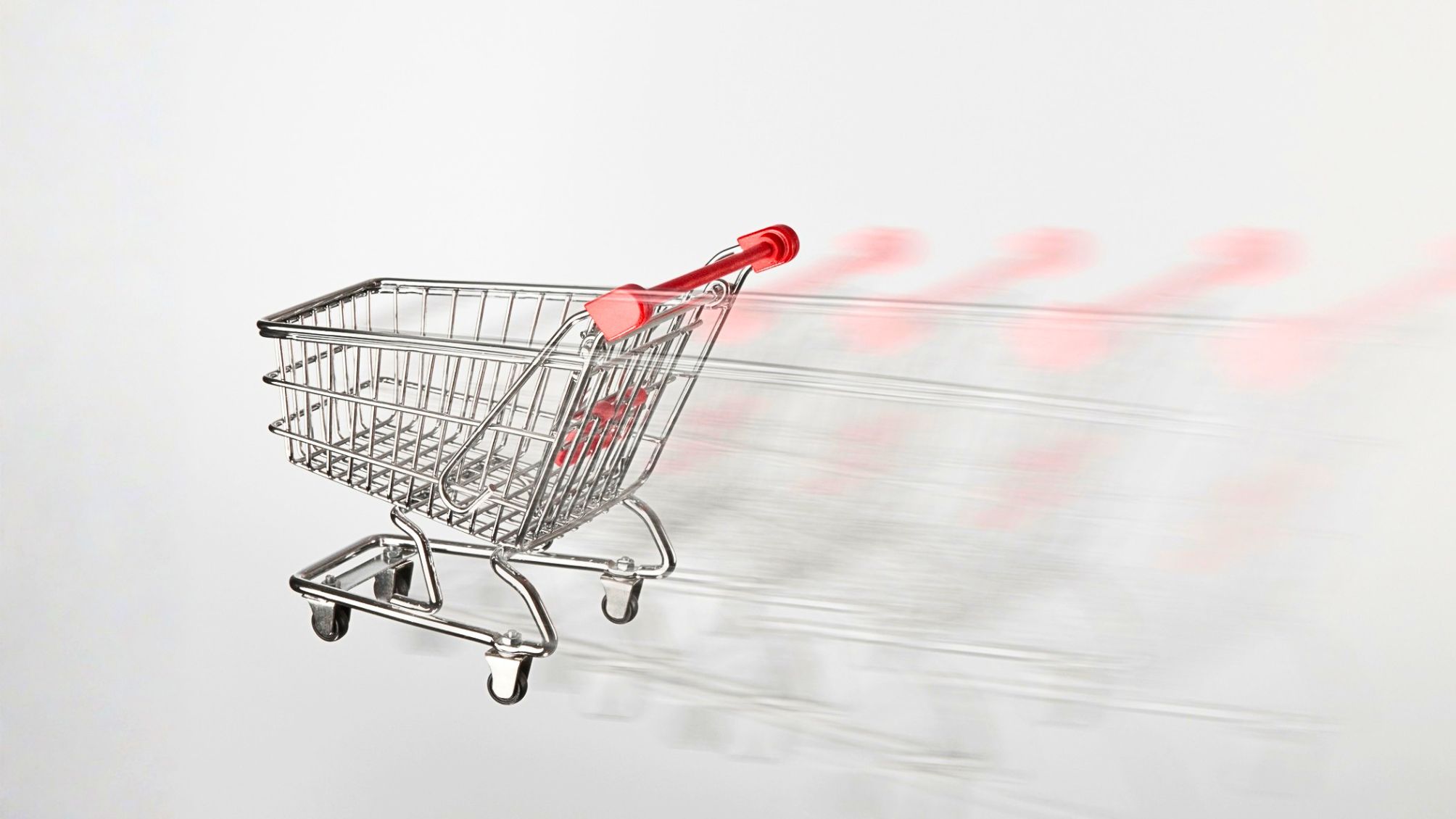 A shopping cart moving quickly out of view