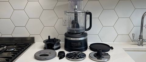 The KitchenAid KFP1319 food processor surrounded by its components
