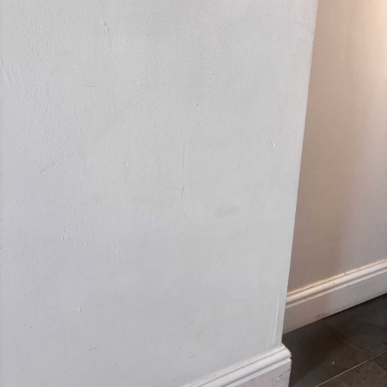 white wall in corner of room