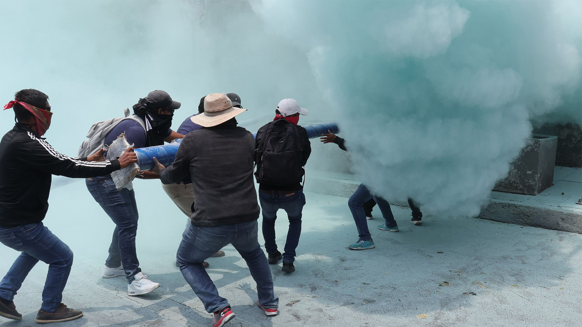 Police deploy tear gas during a demonstration of the National Coordinator of Education Workers in Mexico City, Mexico