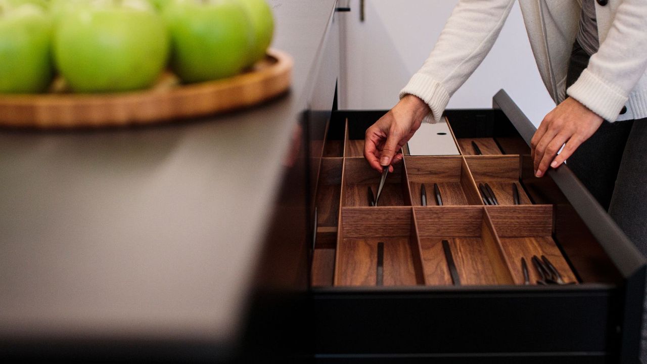 An open kitchen drawer