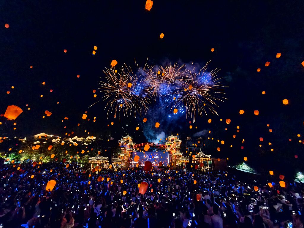 SHAORAO, CHINA - OCTOBER 08: Thousands of lanterns and fireworks light up the night sky over Gexian Village on October 8, 2025 in Shangrao, Jiangxi Province of China. These recyclable electronic lanterns, lifted by helium, create a dazzling display that is both eco-friendly and captivating.