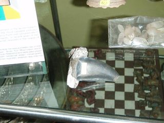 This image shows a fossilized Tarbosaurus bataar tooth for sale in a Mongolian museum, according to attorneys for fossil dealer Eric Prokopi. Mongolian law makes fossils found within its borders state property, and Prokopi's legal team maintains this photo undercuts the Mongolian claim on a Tarbosaurus skeleton he restored and attempted to sell. The Mongolia government says no fossils have been sold in the state-run museum.