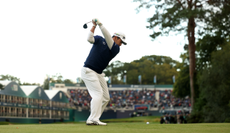 Hideki Matsuyama hits a shot into the green