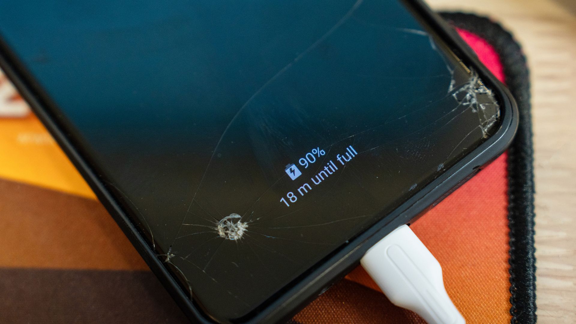 A close up of a phone showing 90% with a