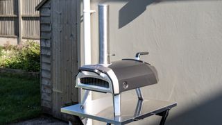 Ooni Karu 2 pizza oven outdoors on a table