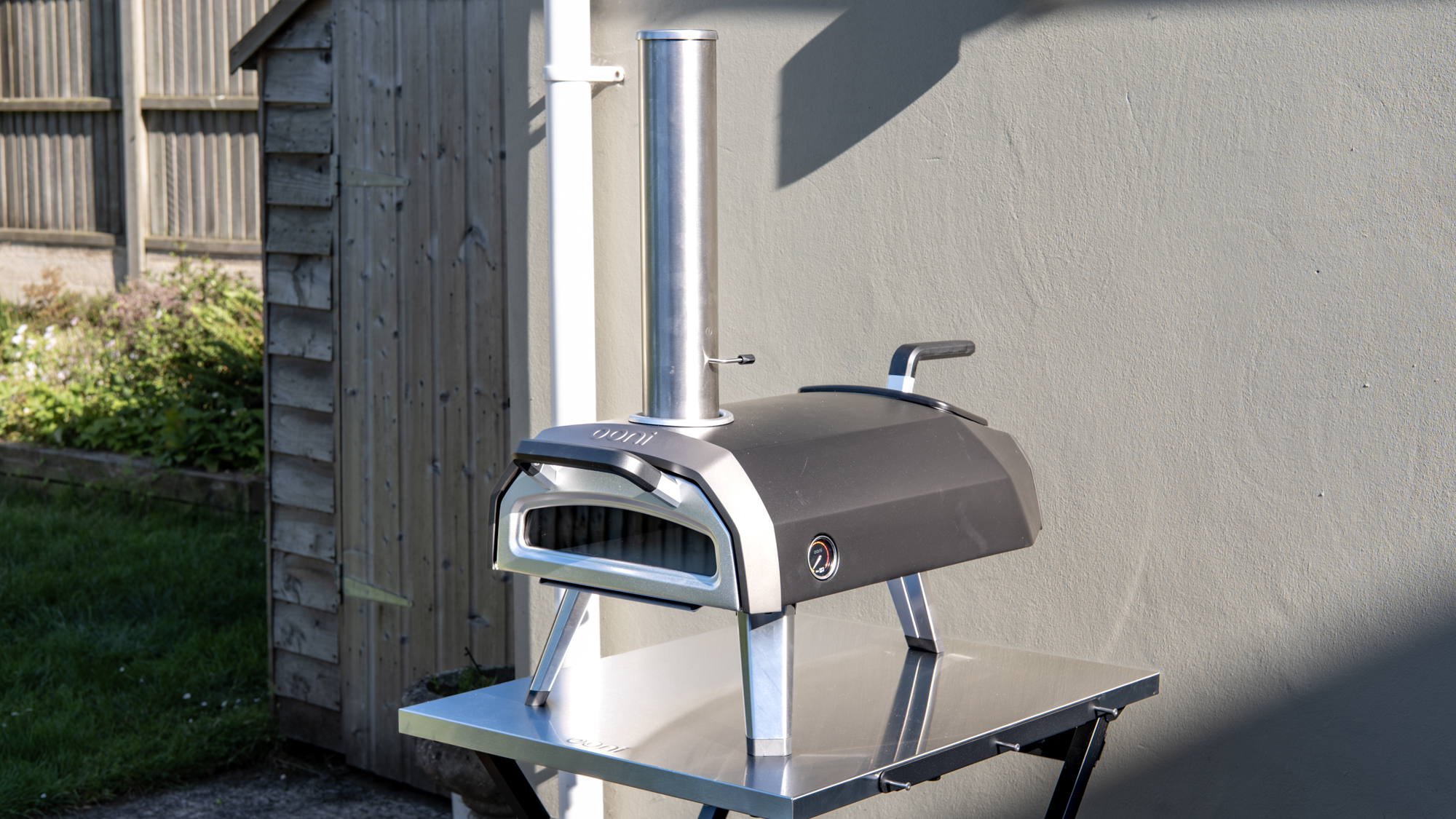 Ooni Karu 2 pizza oven outdoors on a table