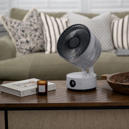 meaco sefte 8 portable fan on a coffee table in a living room