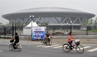 Cyclists without a clear view of Beijing's Laoshan Velodrome