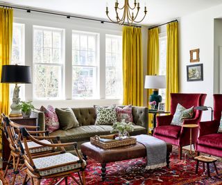 living room with gold curtains and red vintage rug