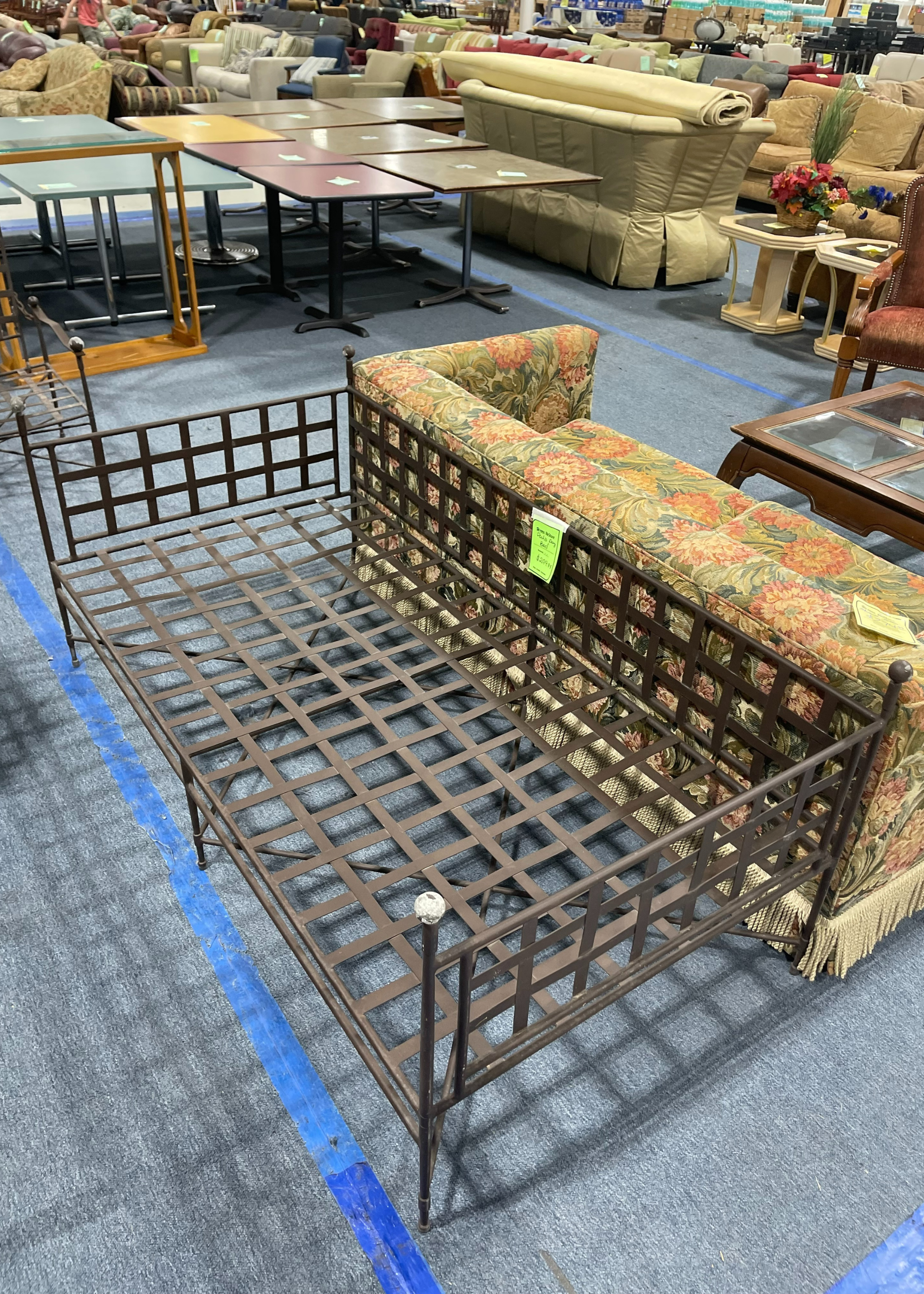 An iron bench in a thrift store