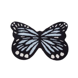 A blue and black butterfly rug