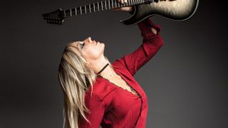 Nita Strauss, photographed in Atlantic City, New Jersey, Septemer 8, 2018, with her signature Ibanez guitar, the JIVA10