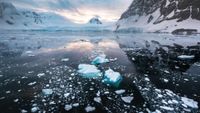 Melting sea ice, snow and mountains in Antarctica.