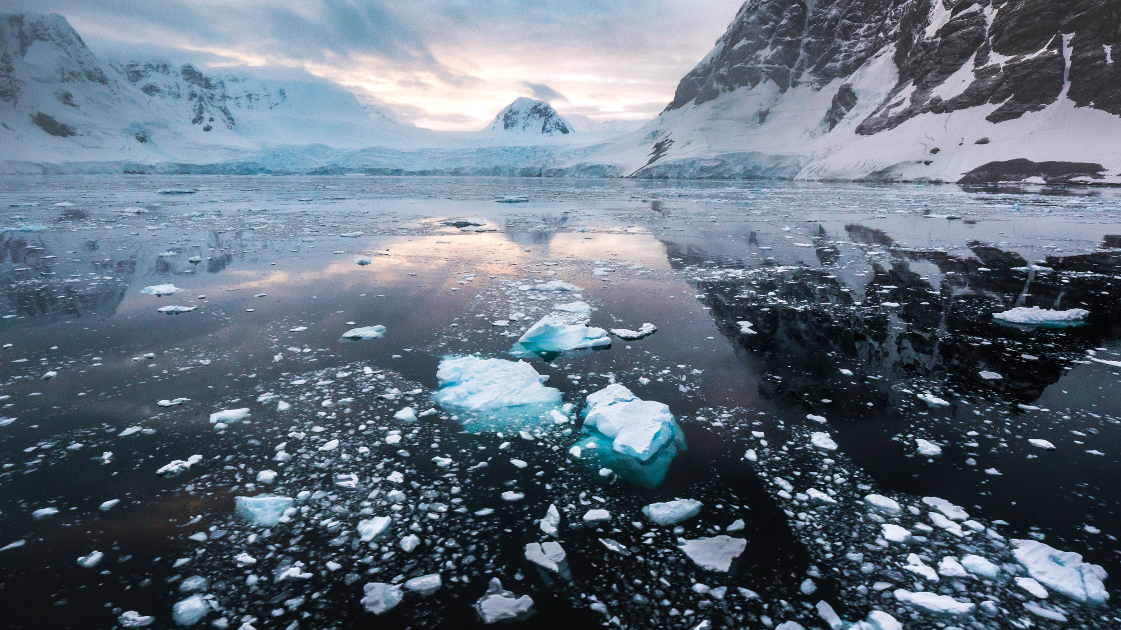 Melting sea ice, snow and mountains in Antarctica.