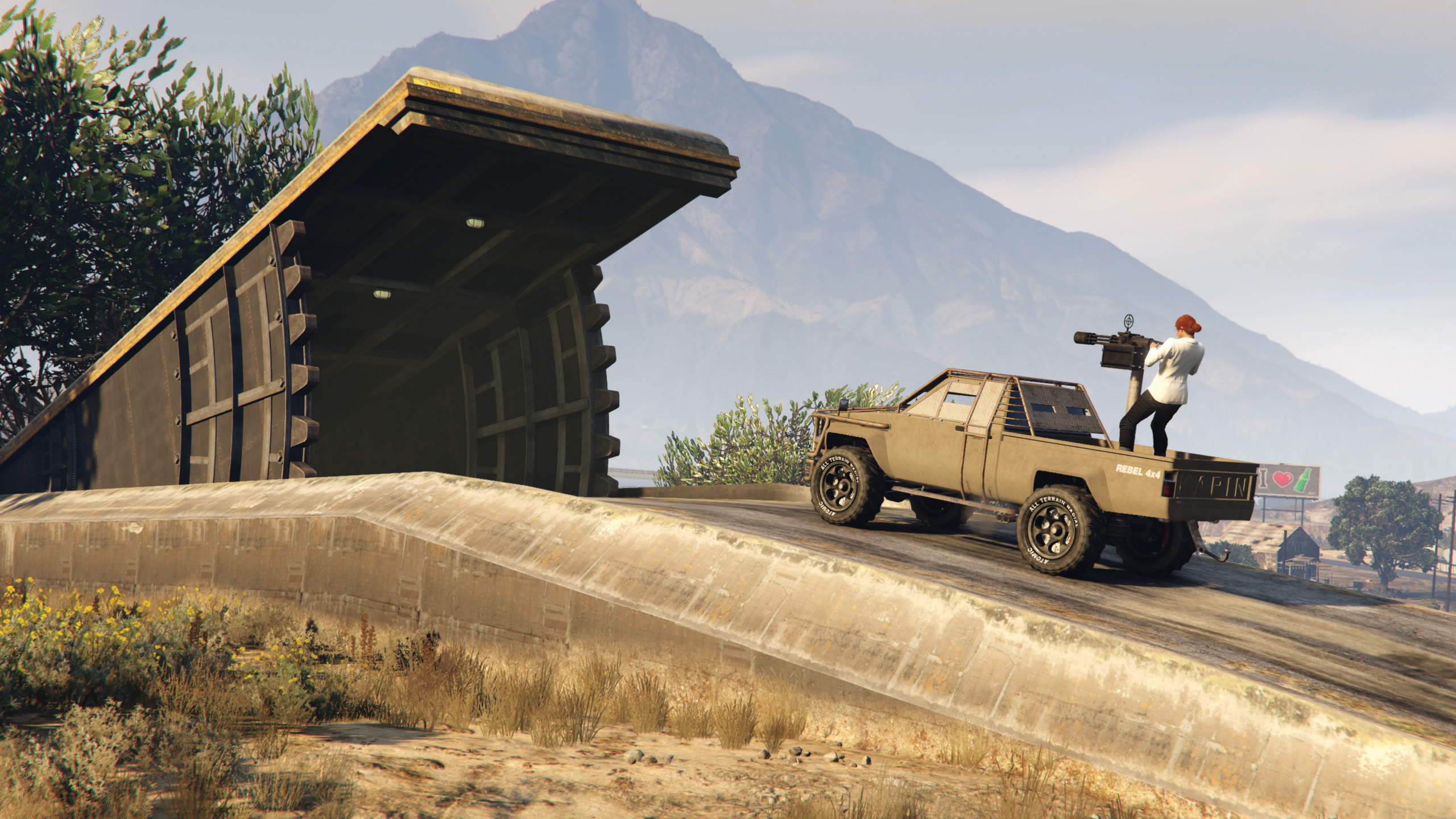An SUV with a minigun driving into the gunrunning bunker in GTA Online.