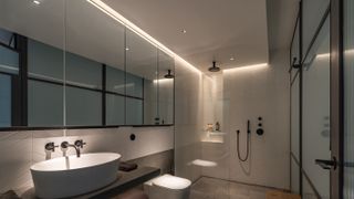 bathroom with dropped ceiling and downlights