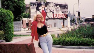 Anna Nicole Smith posing in front of a billboard in Anna Nicole Smith: You Don't Know Me.