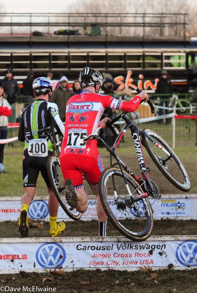 Tim Johnson (Cannondale Cyclocrossworld.com) leads Logan Owen over the barriers