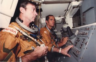 Columbia's gutsy twosome on the maiden voyage of a shuttle orbiter: (L) Commander, John Young and Pilot, Robert Crippen. The two astronauts launched into history books as the crew of NASA's first shuttle mission, STS-1, in April 1981.