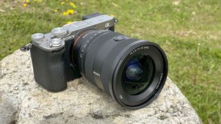 Sony FE 16-35mm F2.8 GM II lens attached to a Sony A7C II, outdoors on a rock