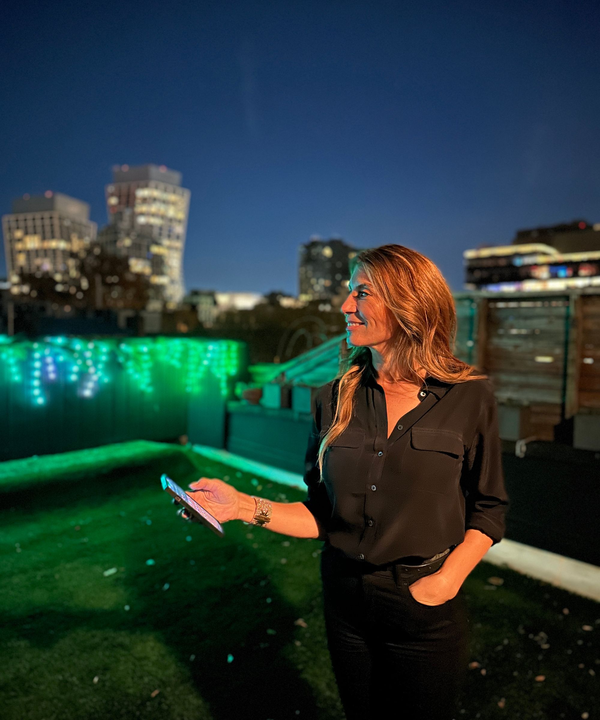 Genevieve Gorder on balcony with outdoor lights