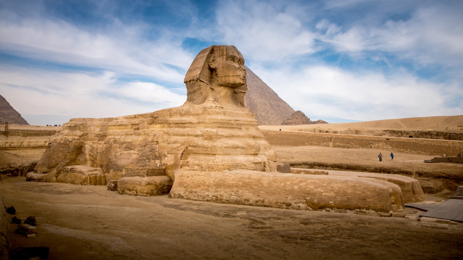 The Sphinx laying down in front of the Great Pyramid of Giza in Egypt. Kitti Boonnitrod via Getty Images.