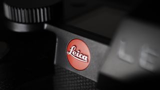 Leica SL3-S on a wooden surface with moody lighting