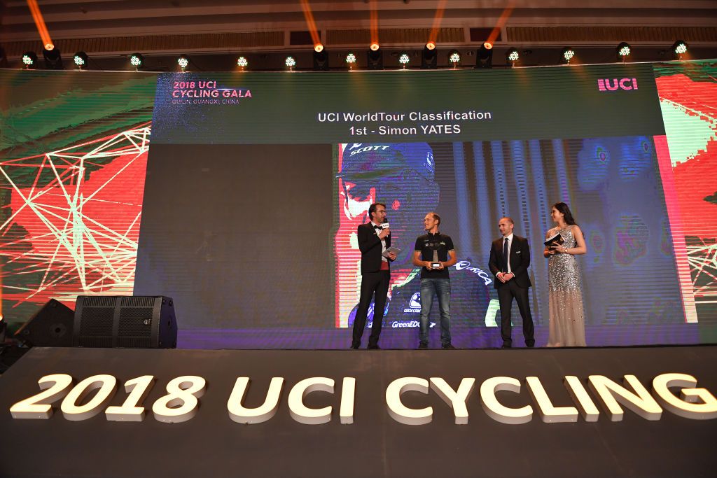2018 men's WorldTour champion Simon Yates wasn't there to collect his award, so teammate Matteo Trentin went up instead