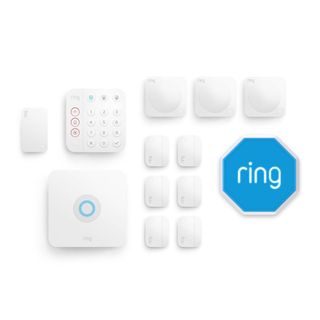 Ring Alarm Pack with multiple accessories and blue alarm on a white background