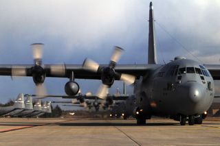 A line of C-130 Hercules aircraft prepare to depart Ramstein Air Base, Germany, in 2003. The craft that was lost in 1969 was also a C-130 Hercules.
