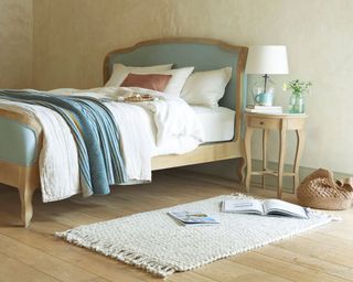 Loaf Mini Marmo side table inside bedroom with blue sleigh bed