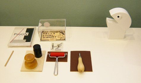 Stamps and writing objects on a white table 