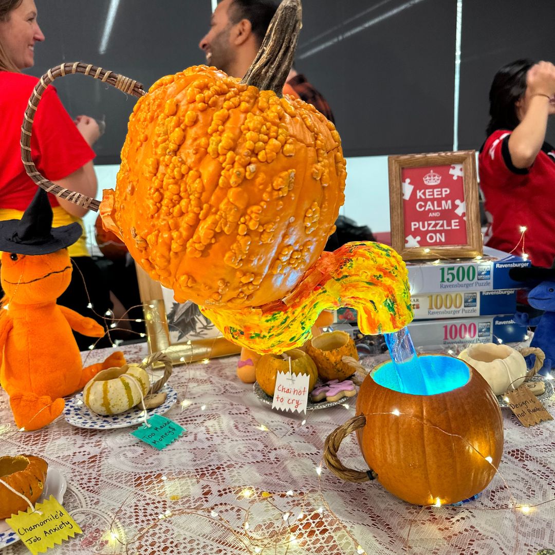 a pumpkin carved to resemble a teapot