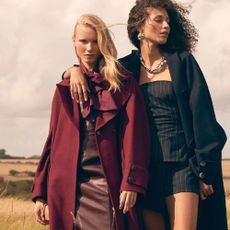 Two women in a field wearing Anthropologie clothing