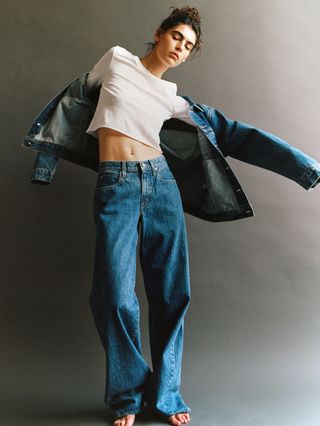 SLVRLAKE model wearing blue jeans, white tee, denim jacket