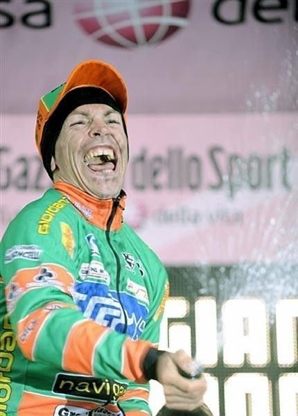 Sella sprays the champagne