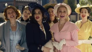 A group of women dressed smartly wearing dresses and hats