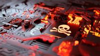 Ransomware concept image showing skull and cross bones on a computer chip sitting on a circuit board.