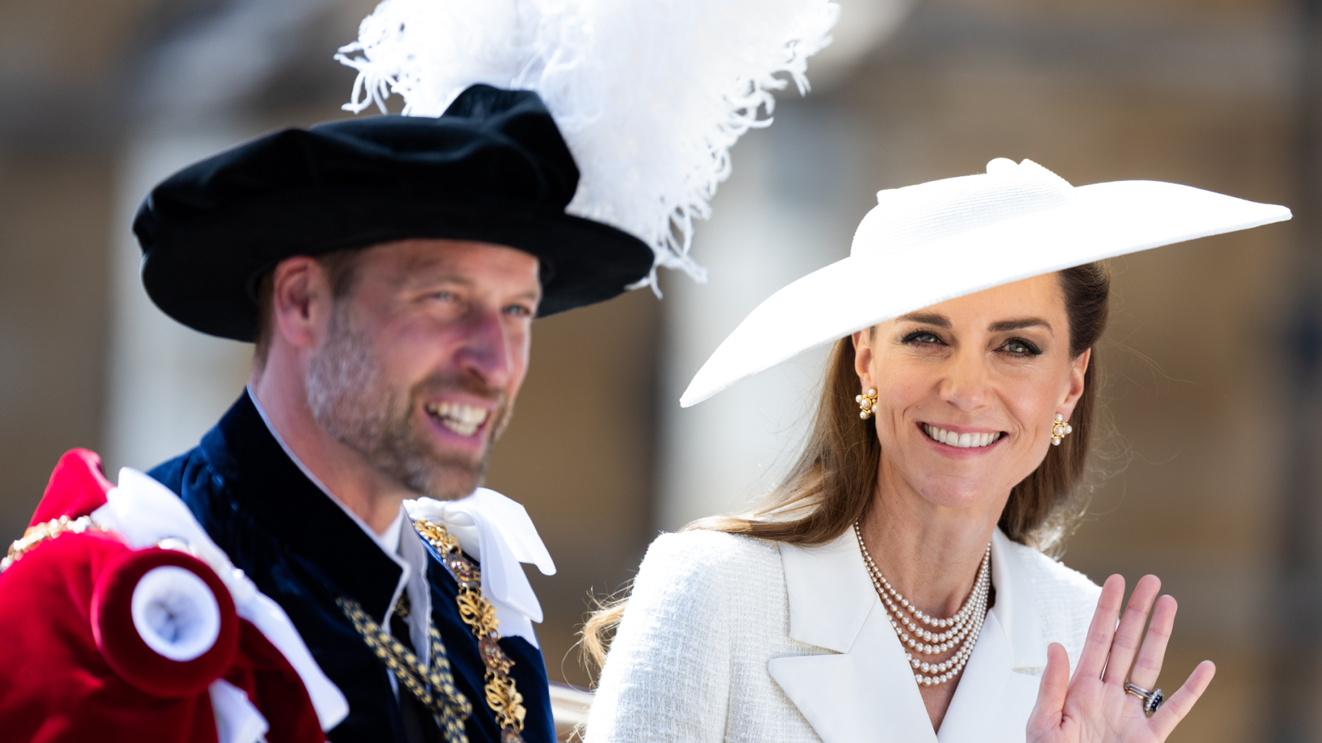 Kate Middleton and Prince William waving from a carriage