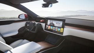 The infotainment unit in a Tesla Model S showing The Witcher III