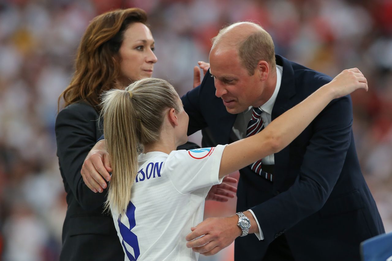 Prince William breaking a royal rule to hug the women's England team after their final win