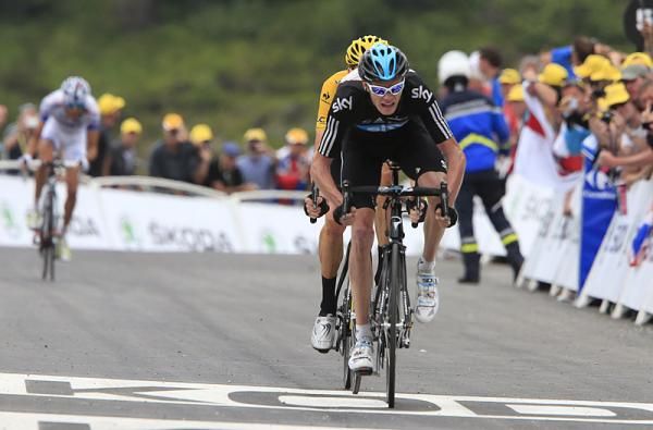 Christopher Froome (Sky) tows his leader across the line