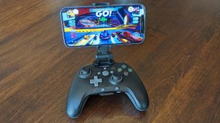 iPhone on PowerA MOGA XP5-i Plus with Sonic Racing on screen.