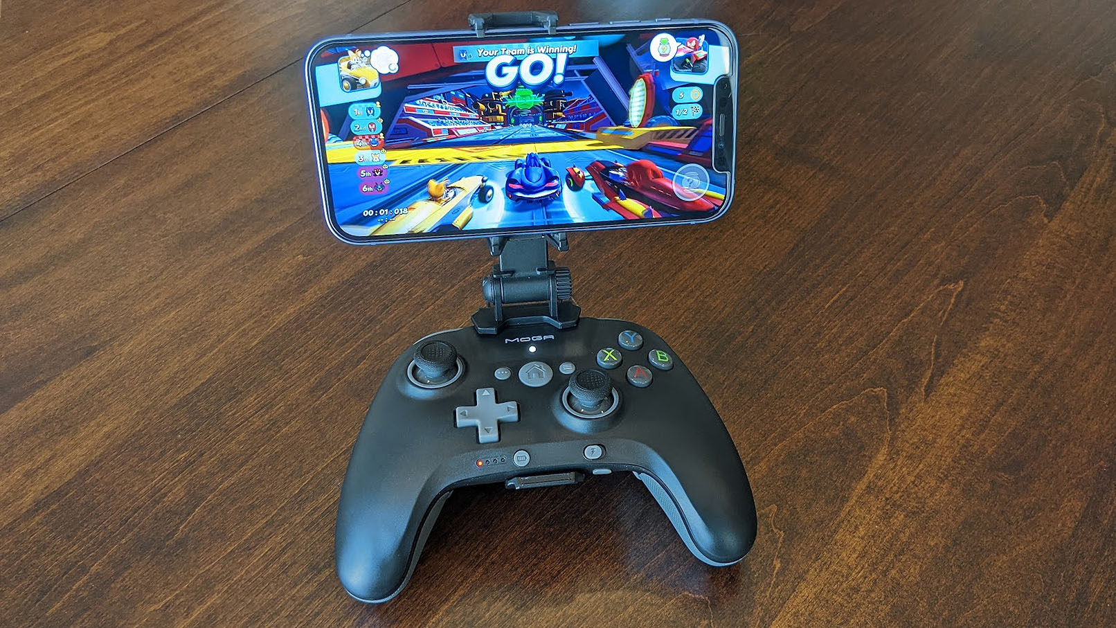 Power on iPhoneA MOGA XP5-i Plus with Sonic Racing on the screen.
