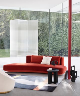 Deirdre Dyson rug in front of a red sofa