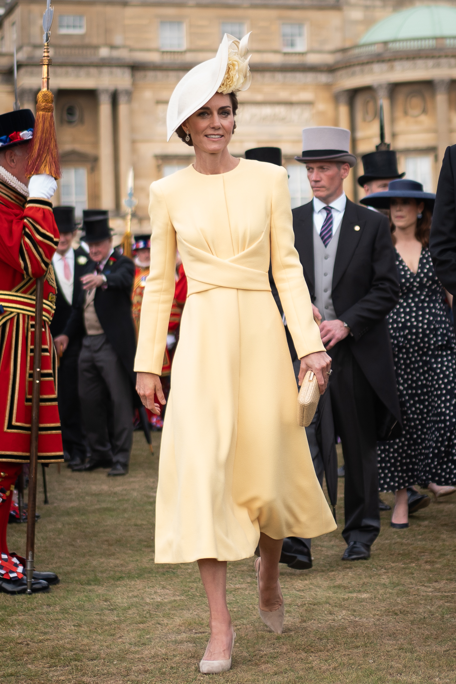 Kate Middleton at a Buckingham Palace garden party in a yellow dress