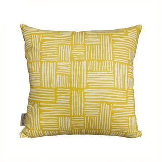 A yellow and white outdoor cushion