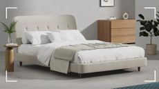 A simba mattress, layered on a Simba bed, with a throw and pillows on top with a bedside table and a cabinet